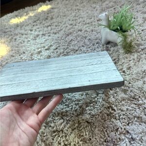 Grey metal triangle invisible shelf with a modern, industrial vibe